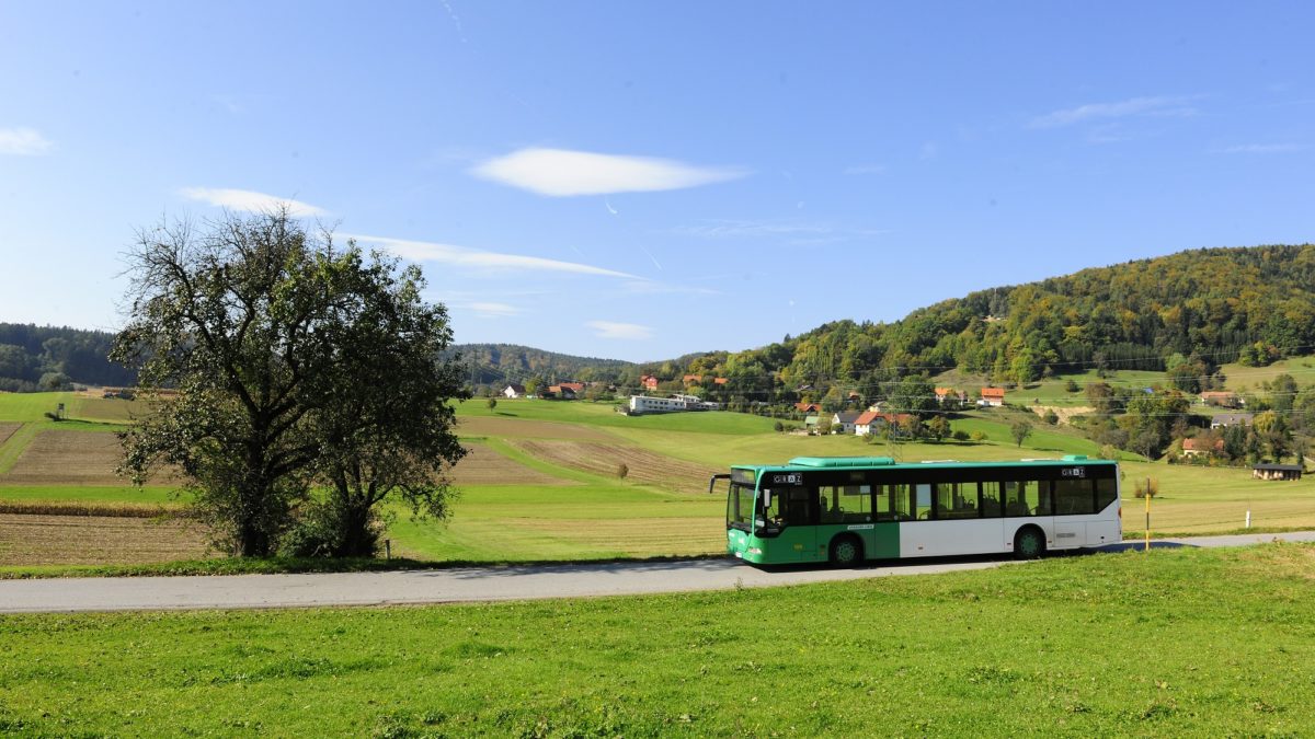 Bus of Graz Linien drives through the landscape in Thal near Graz