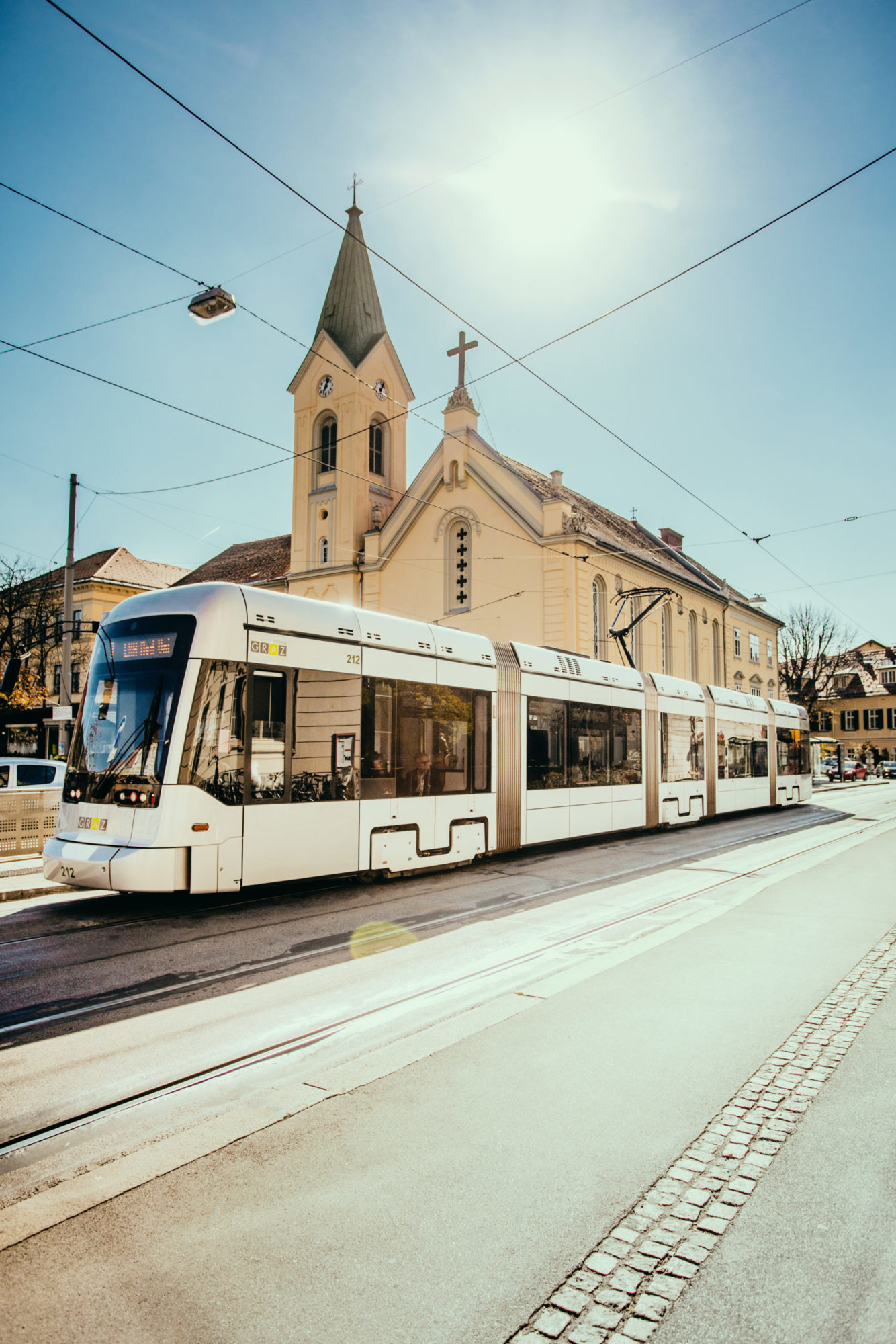 Variobahn tram enters Kaiser-Josef-Platz stop