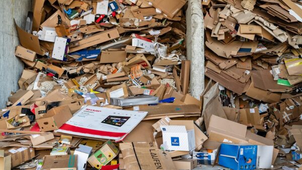 High mountains of cardboard in the recyclables zone