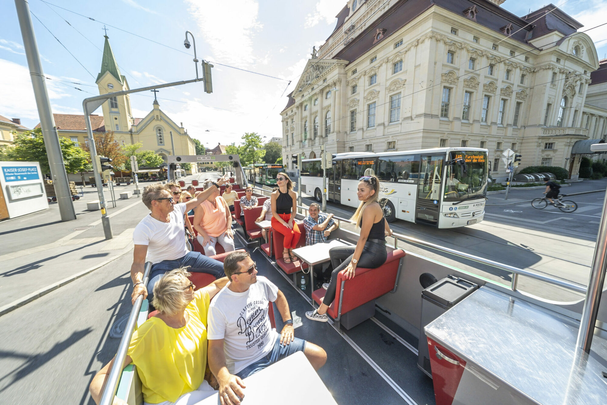 A Graz Linien bus with the roof removed, allowing passengers to enjoy views of the city