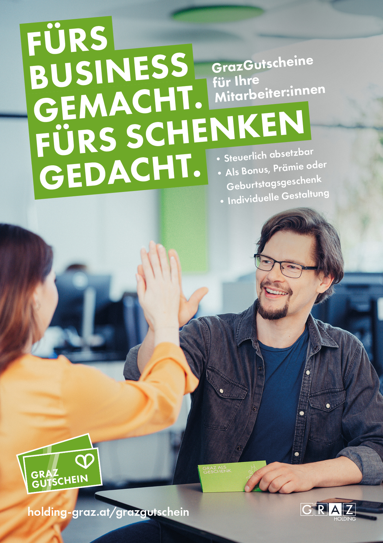 Zwei Personen klatschen freudig ab, daneben Text "GrazGutschein – fürs Schenken gedacht".