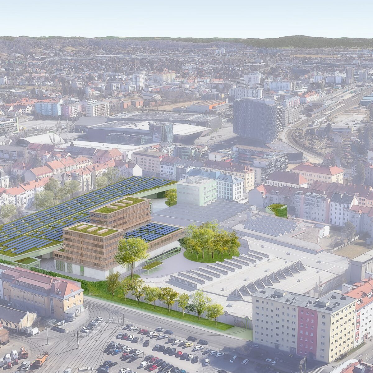 Luftbild der Steyrergasse in Graz mit einem neuen Gebäude mit begrünten Dächern und Solarpaneelen.