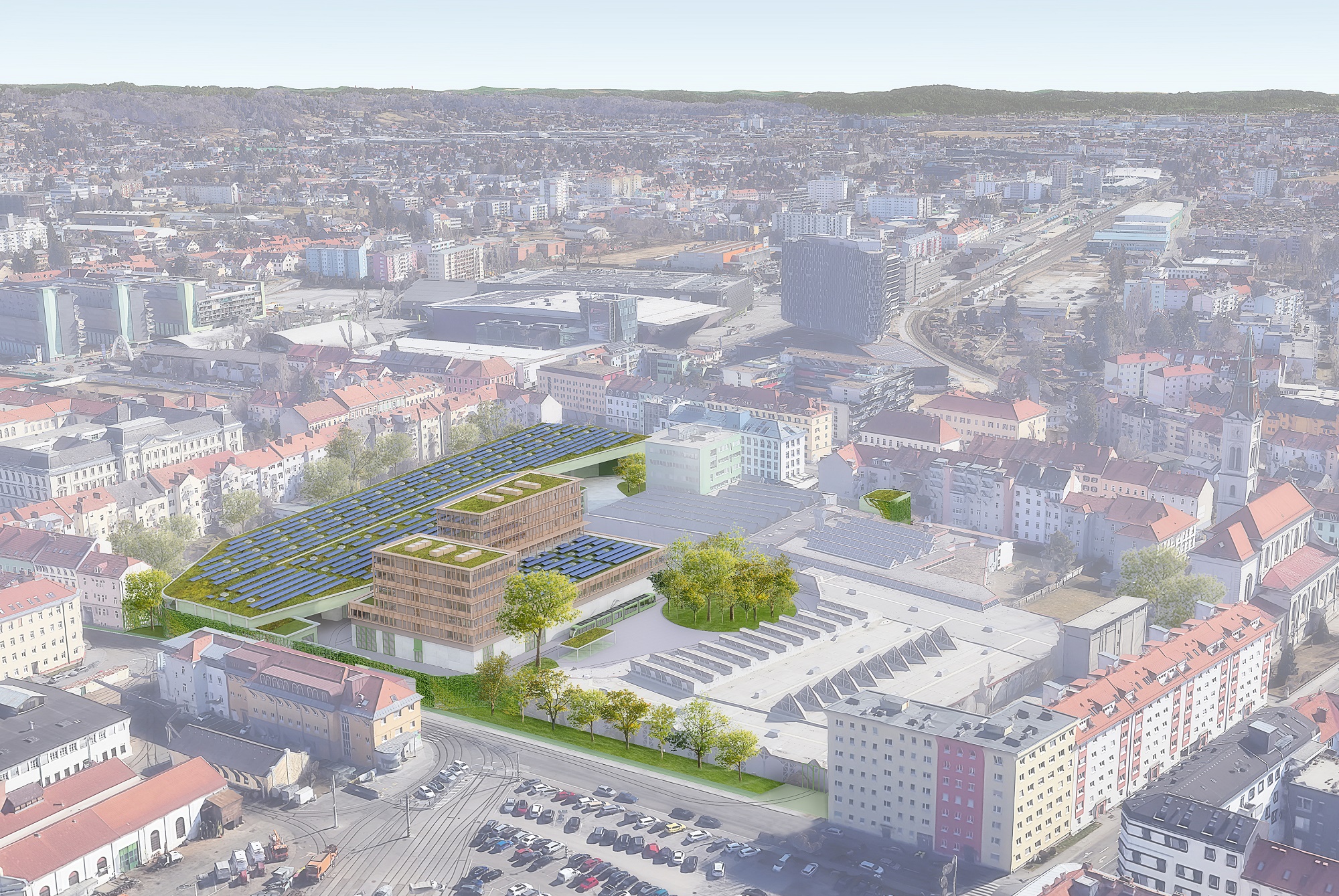 Luftbild der Steyrergasse in Graz mit einem neuen Gebäude mit begrünten Dächern und Solarpaneelen.