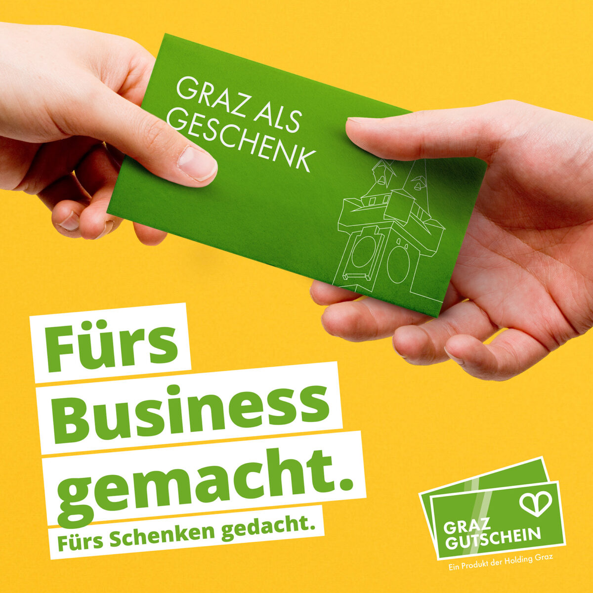 Übergabe des grünen Graz Gutscheins mit Text: Fürs Business gemacht.